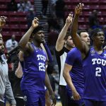 
              TCU players, including Souleymane Doumbia (25) and Emanuel Miller (2) react after a first-round NCAA college basketball tournament game against Seton Hall, Friday, March 18, 2022, in San Diego. TCU won 69-42. (AP Photo/Denis Poroy)
            