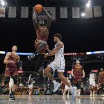 
              Loyola of Chicago's Aher Uguak (30) heads to the basket during the first half of an NCAA college basketball game against Drake in the championship of the Missouri Valley Conference tournament Sunday, March 6, 2022, in St. Louis. (AP Photo/Jeff Roberson)
            