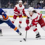 
              Detroit Red Wings left wing Tyler Bertuzzi (59) skates the puck up the ice past New York Islanders center Brock Nelson (29) in the third period of an NHL hockey game, Thursday, March 24, 2022, in Elmont, N.Y. (AP Photo/John Minchillo)
            