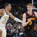 
              Atlanta Hawks' Kevin Huerter (3) is defended by Indiana Pacers' Tyrese Haliburton (0) during the first half of a NBA basketball game, Monday, March 28, 2022, in Indianapolis. (AP Photo/Darron Cummings)
            