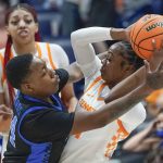 
              Kentucky's Dre'una Edwards (44) pressures Tennessee's Jordan Walker, right, in the first half of an NCAA college basketball semifinal round game at the women's Southeastern Conference tournament Saturday, March 5, 2022, in Nashville, Tenn. (AP Photo/Mark Humphrey)
            