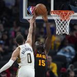 
              Atlanta Hawks' Clint Capela dunks against Indiana Pacers' Tyrese Haliburton during the second half of an NBA basketball game, Monday, March 28, 2022, in Indianapolis. (AP Photo/Darron Cummings)
            