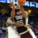 
              Mississippi State forward Tolu Smith goes up to shoot against South Carolina forward Josh Gray during the first half of an NCAA men's college basketball game at the Southeastern Conference tournament in Tampa, Fla., Thursday, March 10, 2022. (AP Photo/Chris O'Meara)
            