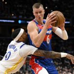 
              Washington Wizards center Kristaps Porzingis (6) drives to the basket against Golden State Warriors guard Gary Payton II (0) during the first half of an NBA basketball game, Sunday, March 27, 2022, in Washington. (AP Photo/Nick Wass)
            