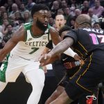 
              Boston Celtics guard Jaylen Brown (7) drives to the basket against Miami Heat forward P.J. Tucker (17) during the first half of an NBA basketball game Wednesday, March 30, 2022, in Boston. (AP Photo/Charles Krupa)
            