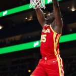 
              Atlanta Hawks center Clint Capela (15) scores during the first half of an NBA basketball game against the Indiana Pacers, Sunday, March 13, 2022, in Atlanta. (AP Photo/Hakim Wright Sr.)
            