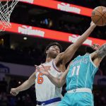 
              New York Knicks guard Quentin Grimes (6) attempts to block the shot of Charlotte Hornets forward Cody Martin (11) during the first half of an NBA basketball game Wednesday, March 23, 2022, in Charlotte, N.C. (AP Photo/Rusty Jones)
            