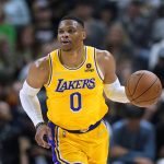 
              Los Angeles Lakers guard Russell Westbrook brings the ball up during the first half of the team's NBA basketball game against the Utah Jazz on Thursday, March 31, 2022, in Salt Lake City. (AP Photo/Rick Bowmer)
            