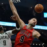 
              Chicago Bulls' Nikola Vucevic knocks the ball from Milwaukee Bucks' Bobby Portis during the first half of an NBA basketball game Tuesday, March 22, 2022, in Milwaukee . (AP Photo/Morry Gash)
            