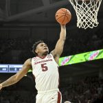 
              Arkansas guard Au'Diese Toney (5) scores on a fast break against LSU during the first half of an NCAA college basketball game Wednesday, March 2, 2022, in Fayetteville, Ark. (AP Photo/Michael Woods)
            