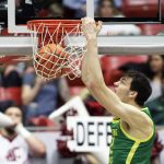 
              Oregon center Nate Bittle dunks during the second half of an NCAA college basketball game against Washington State, Saturday, March 5, 2022, in Pullman, Wash. Washington State won 94-74. (AP Photo/Young Kwak)
            