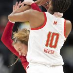 
              Indiana guard Nicole Cardano-Hillary (4) collides with Maryland forward Angel Reese (10) during an NCAA college basketball game in the Big Ten conference tournament, Friday, March 4, 2022, at Gainbridge Fieldhouse in Indianapolis. (Robert Scheer/The Indianapolis Star via AP)
            