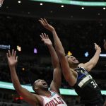 
              Milwaukee Bucks forward Giannis Antetokounmpo (34) battles Chicago Bulls' Tristan Thompson (3) for a rebound during the first half of an NBA basketball game Friday, March 4, 2022, in Chicago. (AP Photo/Paul Beaty)
            