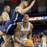 
              Mississippi State forward Tolu Smith (35) is defended by a Virginia player during an NCAA college basketball game in the first round of the NIT, Wednesday, March 16, 2022, in Charlottesville, Va. (Erin Edgerton/The Daily Progress via AP)
            