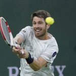 
              Cameron Norrie, of Britain, returns to Carlos Alcaraz, of Spain, during a quarterfinal match in the BNP Paribas Open tennis tournament Thursday, March 17, 2022, in Indian Wells, Calif. (AP Photo/Mark J. Terrill)
            