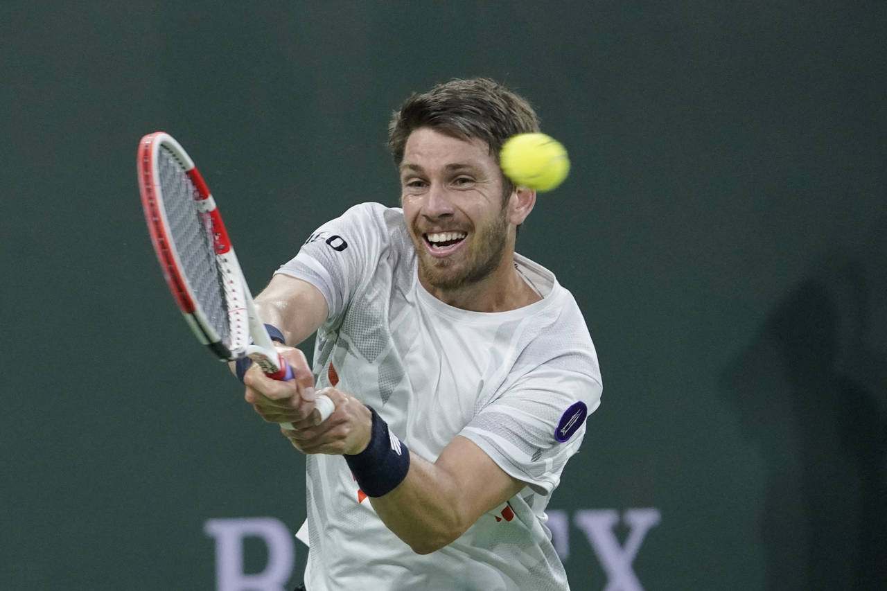 Cameron Norrie, of Britain, returns to Carlos Alcaraz, of Spain, during a quarterfinal match in the...
