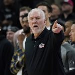 
              San Antonio Spurs head coach Gregg Popovich signals to his players during the second half of an NBA basketball game against the Utah Jazz, Friday, March 11, 2022, in San Antonio. The Spurs won, making Popovich the all-time winningest coach in NBA regular-season history. (AP Photo/Eric Gay)
            
