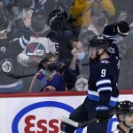 
              Winnipeg Jets' Andrew Copp (9) celebrates his goal against the Montreal Canadiens during the second period of an NHL hockey game Tuesday, March 1, 2022, in Winnipeg, Manitoba. (Fred Greenslade/The Canadian Press via AP)
            