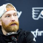 
              Philadelphia Flyers' Claude Giroux speaks with members of the media during a news conference at the team's NHL hockey practice facility, Wednesday, March 16, 2022, in Voorhees, N.J. Giroux's 1,000th career game with the Flyers on Thursday night could be his last in orange-and-black for the 34-year-old center approaching the final months of his contract. (AP Photo/Matt Rourke)
            