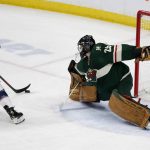 
              Minnesota Wild goaltender Marc-Andre Fleury (29) makes a stop on Columbus Blue Jackets right wing Justin Danforth (17) during the first period of an NHL hockey game Saturday, March 26, 2022, in St. Paul, Minn. (AP Photo/Andy Clayton-King)
            