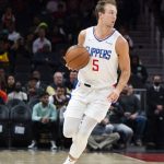 
              Los Angeles Clippers guard Luke Kennard (5) dribbles upcourt during the first half of an NBA basketball game against the Atlanta Hawks, Friday, March 11, 2022, in Atlanta. (AP Photo/Hakim Wright Sr.)
            