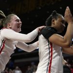 
              Dayton guard Erin Whalen, left, celebrates with teammate Tenin Magassa, right, after a First Four game against DePaul in the NCAA women's college basketball tournament, Wednesday, March 16, 2022, in Ames, Iowa. Dayton won 88-57. (AP Photo/Charlie Neibergall)
            