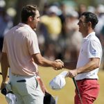 
              Scottie Scheffler, left, shakes hand with Billy Horschel after defeating him 1-up on the 18th hole during the round of 16 of the Dell Technologies Match Play Championship golf tournament, Saturday, March 26, 2022, in Austin, Texas. (AP Photo/Tony Gutierrez)
            