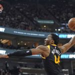 
              Utah Jazz guard Donovan Mitchell goes to the basket for a dunk against the Los Angeles Lakers during the second half of an NBA basketball game Thursday, March 31, 2022, in Salt Lake City. (AP Photo/Rick Bowmer)
            