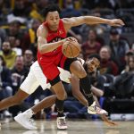 
              Toronto Raptors' Scottie Barnes (4) brings the ball upcourt against Cleveland Cavaliers' Evan Mobley during the second half of an NBA basketball game, Sunday, March 6, 2022, in Cleveland. (AP Photo/Ron Schwane)
            