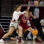 
              Notre Dame forward Maddy Westbeld, left, guards against Massachusetts forward Sam Breen, right, in the first half of a first-round game in the NCAA women's college basketball tournament Saturday, March 19, 2022, in Norman, Okla. (AP Photo/ Mitch Alcala)
            
