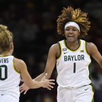 
              Baylor forward NaLyssa Smith (1) celebrates a play with teammate Jaden Owens (10) during the second half of an NCAA college basketball game against Oklahoma in the semifinal round of the Big 12 Conference tournament in Kansas City, Mo., Saturday, March 12, 2022. (AP Photo/Reed Hoffmann)
            