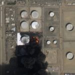 
              This satellite photo from Planet Labs PBC shows a fire still burning at Saudi Aramco's North Jiddah Bulk Plant after an attack by Yemen's Houthi rebels ahead of a Formula One race in Jiddah, Saudi Arabia, Saturday, March 26, 2022. Authorities pledged Saturday that the F1 race would go on Sunday. (Planet Labs PBC via AP)
            