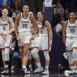 
              From left to right, Connecticut's Paige Bueckers, Olivia Nelson-Ododa, Nika Muhl and Azzi Fudd react during the first half of a second-round women's college basketball game against Central Florida in the NCAA tournament, Monday, March 21, 2022, in Storrs, Conn. (AP Photo/Jessica Hill)
            