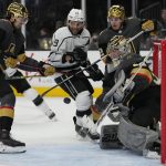 
              Vegas Golden Knights goaltender Logan Thompson (36) blocks a shot by the Los Angeles Kings during the third period of an NHL hockey game Saturday, March 19, 2022, in Las Vegas. (AP Photo/John Locher)
            