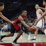 
              Portland Trail Blazers guard Kris Dunn, center, drives to the basket past Oklahoma City Thunder forward Jeremiah Robinson-Earl, second from left, and center Olivier Sarr , right, during the first half of an NBA basketball game in Portland, Ore., Monday, March 28, 2022. (AP Photo/Craig Mitchelldyer)
            