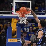 
              Duke's Paolo Banchero (5) dunks against Pittsburgh during the first half of an NCAA college basketball game, Tuesday, March 1, 2022, in Pittsburgh. (AP Photo/Keith Srakocic)
            