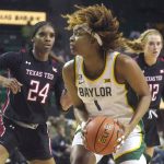 
              Baylor forward NaLyssa Smith (1) controls the ball against Texas Tech forward Taylah Thomas (24) during the first half of an NCAA college basketball game in Waco, Texas, Sunday, March 6, 2022. (AP Photo/LM Otero)
            