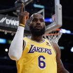 
              Los Angeles Lakers' LeBron James celebrates his basket against the Toronto Raptors during first half of an NBA basketball game Monday, March 14, 2022, in Los Angeles. (AP Photo/Jae C. Hong)after
            