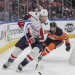 
              Washington Capitals Anthony Mantha (39) carries the puck chased by Edmonton Oilers Duncan Keith (2) during the first period of an NHL hockey game Wednesday, March 9, 2022 in Edmonton, Alberta.(Amber Bracken/The Canadian Press via AP)
            