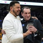 
              Pittsburgh coach Jeff Capel, left, embraces Duke coach Mike Krzyzewski after presenting him with a trophy sculpture before an NCAA college basketball game Tuesday, March 1, 2022, in Pittsburgh. (AP Photo/Keith Srakocic)
            