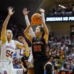 
              Princeton guard Kaitlyn Chen (20) shoots over Indiana forward Mackenzie Holmes (54) in the first half of a college basketball game in the second round of the NCAA tournament in Bloomington, Ind., Monday, March 21, 2022. (AP Photo/Michael Conroy)
            