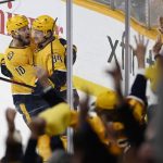 
              Nashville Predators' Tanner Jeannot (84) is congratulated by Colton Sissons (10) after Jeannot scored the winning goal against the Philadelphia Flyers in the third period of an NHL hockey game Sunday, March 27, 2022, in Nashville, Tenn. The Predators won 5-4. (AP Photo/Mark Zaleski)
            