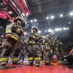 
              The NBA basketball game is suspended between the Toronto Raptors and the Indiana Pacers as firefighters work to evacuate the building during the first half Saturday, March 26, 2022, in Toronto. (Frank Gunn/The Canadian Press via AP)
            