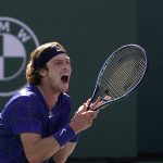 
              Andrey Rublev, of Russia, reacts after losing a game against Taylor Fritz during their men's singles semifinals at the BNP Paribas Open tennis tournament Saturday, March 19, 2022, in Indian Wells, Calif. (AP Photo/Mark J. Terrill)
            