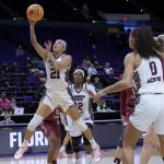 
              Missouri State guard Sydney Wilson (21) shoots against Florida State guard O'Mariah Gordon (11) during the first half of a First Four game in the NCAA women's college basketball tournament Thursday, March 17, 2022, in Baton Rouge, La. (AP Photo/Matthew Hinton)
            