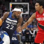 
              Minnesota Timberwolves guard Patrick Beverley (22) brings the ball around Portland Trail Blazers guard Brandon Williams (8) in the first quarter of an NBA basketball game Monday, March 7, 2022, in Minneapolis. (AP Photo/Bruce Kluckhohn)
            
