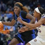 
              Kentucky's Rhyne Howard (10) is guarded by LSU's Khayla Pointer (3) in the second half of an NCAA college basketball game at the women's Southeastern Conference tournament Friday, March 4, 2022, in Nashville, Tenn. (AP Photo/Mark Humphrey)
            