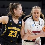 
              Louisville guard Hailey Van Lith (10) drives on Michigan guard Danielle Rauch (23) during the first half of a college basketball game in the Elite 8 round of the NCAA women's tournament Monday, March 28, 2022, in Wichita, Kan. (AP Photo/Jeff Roberson)
            