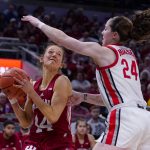 
              Indiana guard Ali Patberg (14) looks to shoot against Ohio State guard Taylor Mikesell (24) in the second half of an NCAA college basketball game at the Big Ten Conference tournament in Indianapolis, Saturday, March 5, 2022. (AP Photo/Michael Conroy)
            