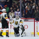 
              Vegas Golden Knights' Reilly Smith, left, and Robin Lehner react after a goal by Philadelphia Flyers' Oskar Lindblom during the first period of an NHL hockey game, Tuesday, March 8, 2022, in Philadelphia. (AP Photo/Matt Slocum)
            
